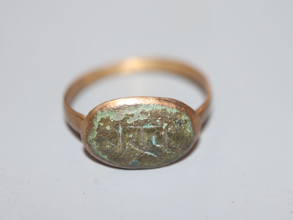 An antique base metal and bronze ring, with monogram, size P,